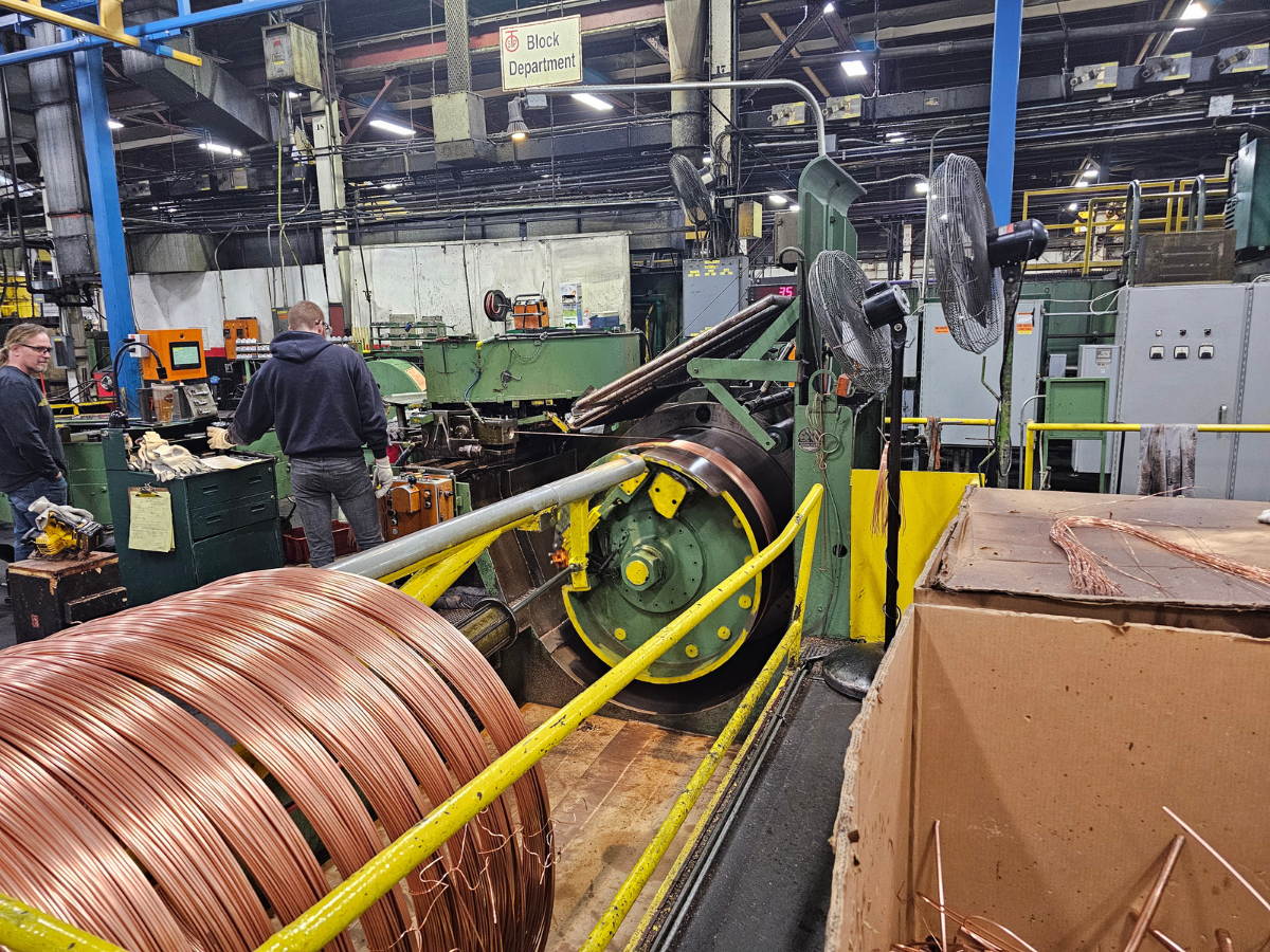 TUBE SPOOL WINDING POSITIONER: ELIMINATED HYDRAULIC ISSUES AND INCREASED SPOOL YIELDS WITH HYBRID LINEAR ACTUATORS